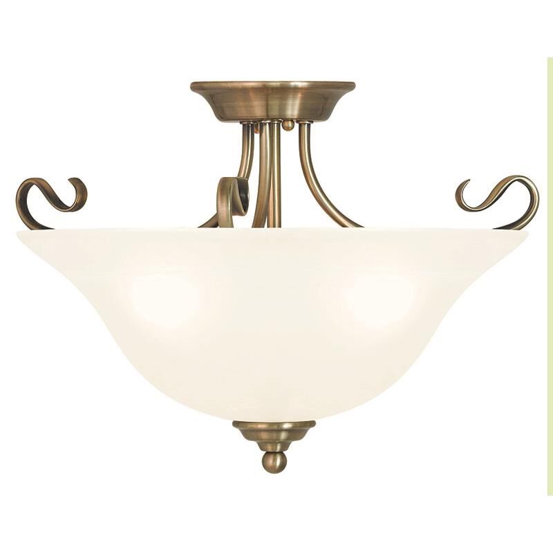 Shown in Antique Brass finish and White Alabaster glass